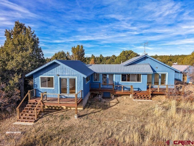 rear view of property with a deck