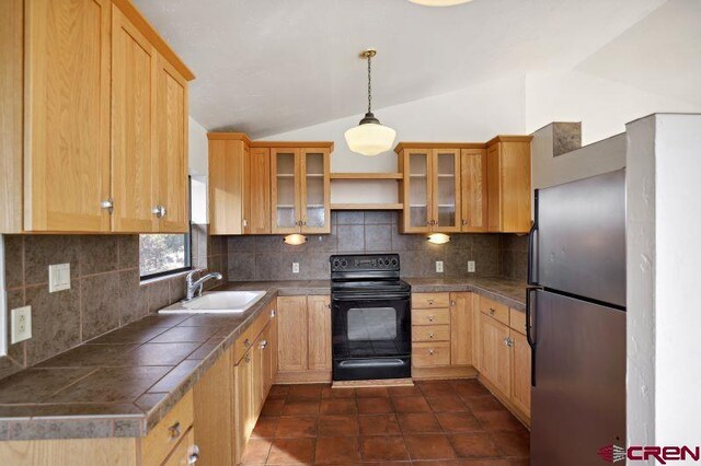 kitchen featuring tasteful backsplash, vaulted ceiling, sink, black range with electric stovetop, and hanging light fixtures