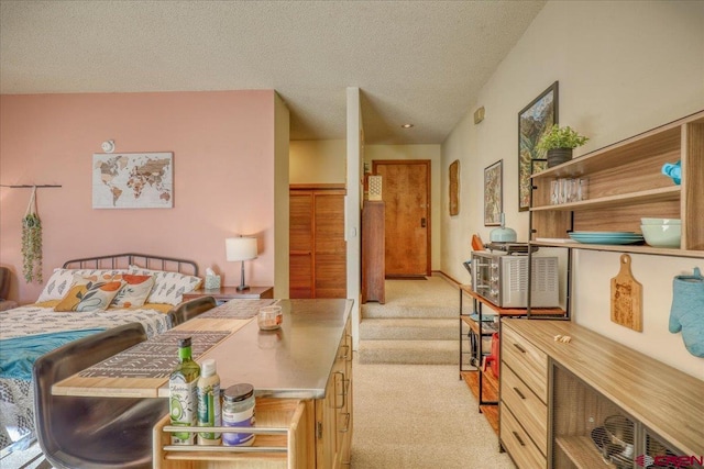 carpeted bedroom with a textured ceiling