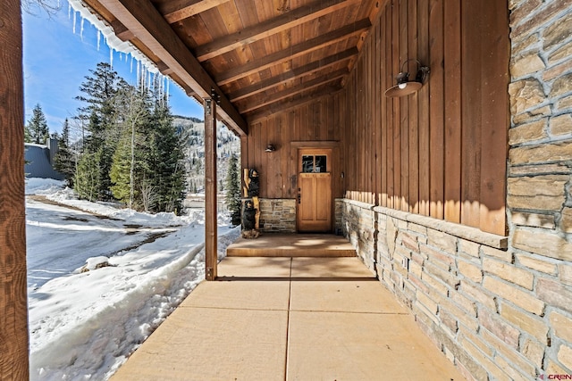 view of snow covered property entrance