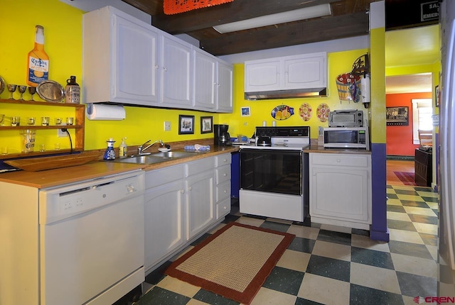 kitchen with white appliances, white cabinets, sink, beam ceiling, and extractor fan