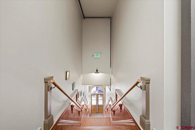 stairway featuring wood-type flooring