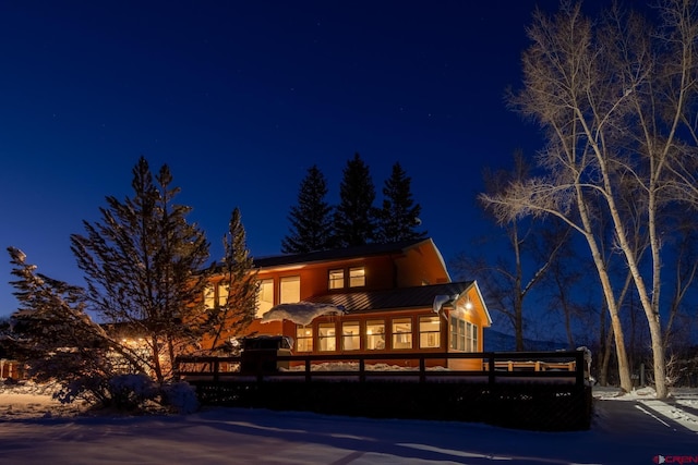 view of front of home featuring a wooden deck