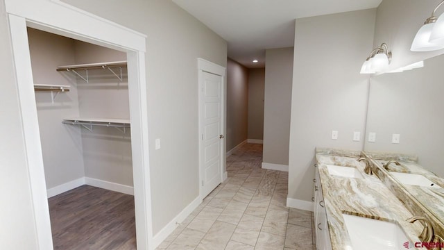 bathroom with hardwood / wood-style flooring and vanity