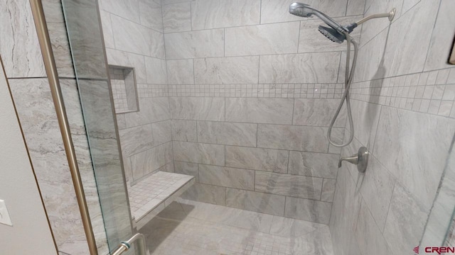 bathroom featuring tiled shower