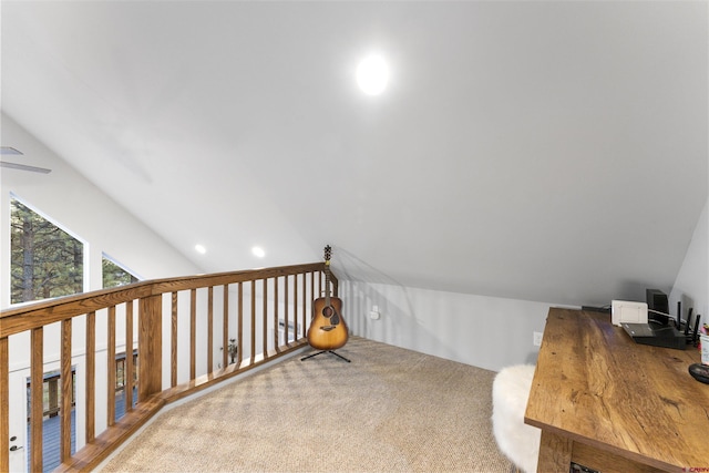 bonus room with carpet floors and vaulted ceiling