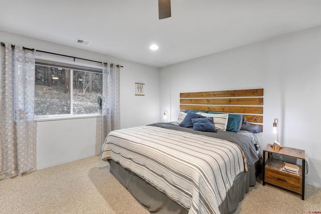 bedroom with light colored carpet and ceiling fan