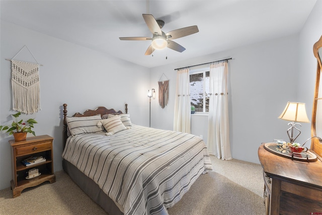 bedroom featuring light colored carpet and ceiling fan