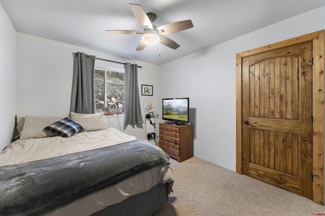 bedroom with ceiling fan and carpet floors