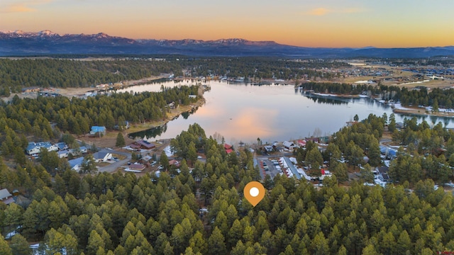 aerial view at dusk with a water view