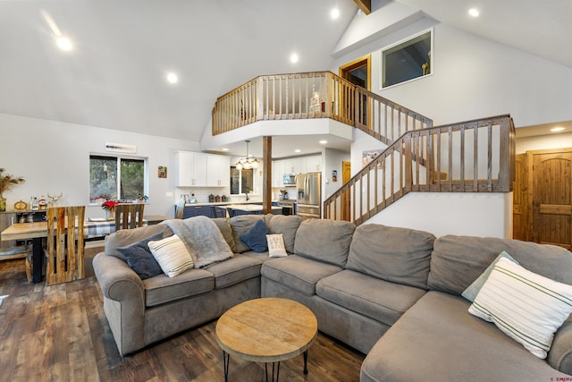 living room featuring dark hardwood / wood-style floors and high vaulted ceiling