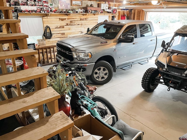 garage featuring wooden walls