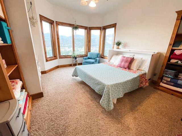 carpeted bedroom featuring a mountain view