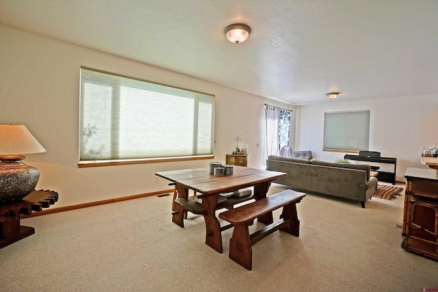 dining room featuring light colored carpet