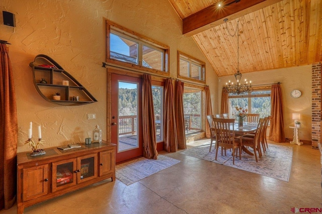 dining space featuring a notable chandelier, beam ceiling, wooden ceiling, and high vaulted ceiling