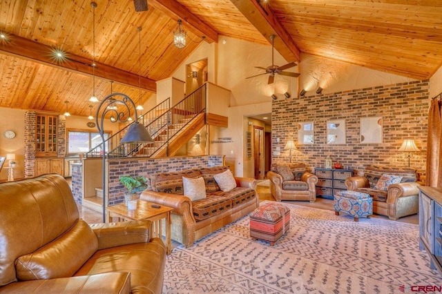 living room with wooden ceiling, high vaulted ceiling, ceiling fan, beamed ceiling, and brick wall