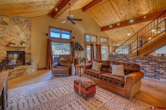 carpeted living room with beam ceiling, ceiling fan, wooden ceiling, a stone fireplace, and high vaulted ceiling