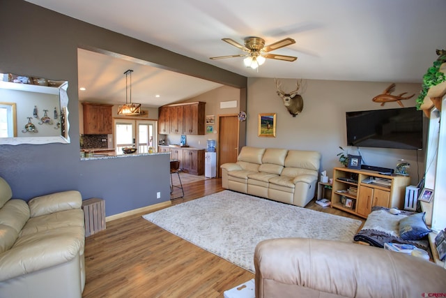 living room featuring hardwood / wood-style floors, ceiling fan, lofted ceiling with beams, and french doors