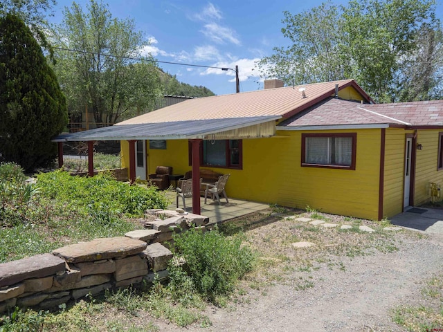 back of house with a patio area