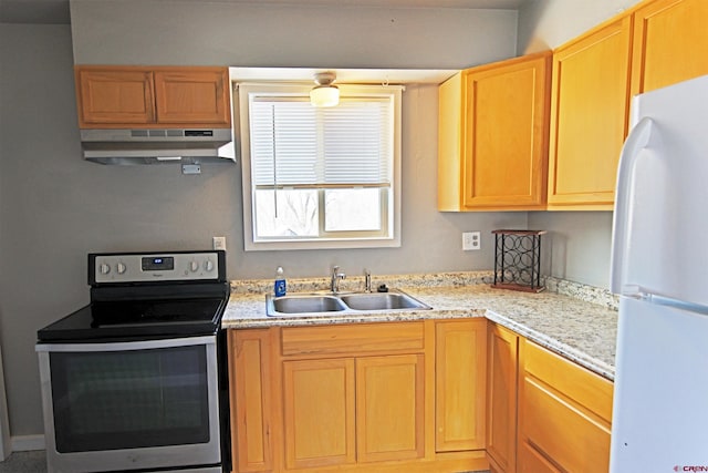 kitchen with stainless steel range with electric stovetop, white refrigerator, and sink