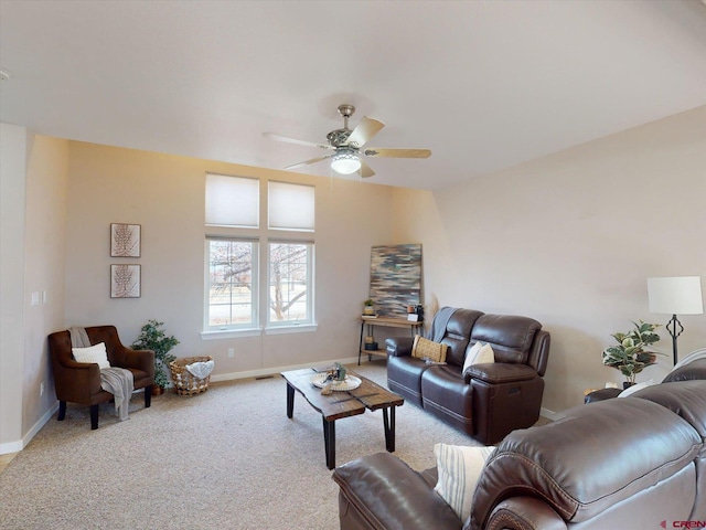 carpeted living room with ceiling fan