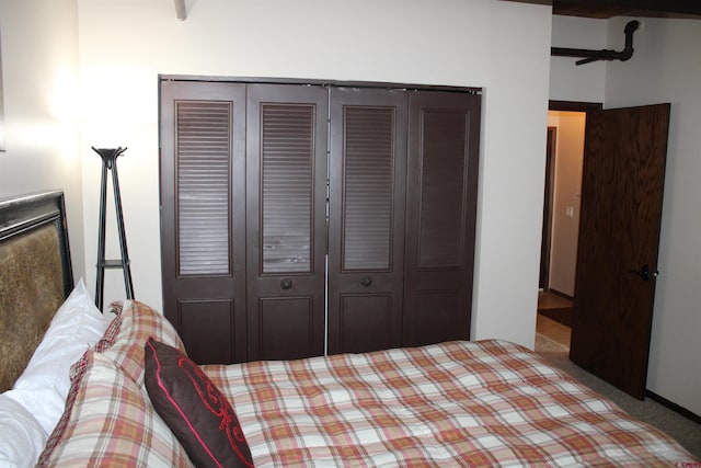 carpeted bedroom featuring a closet