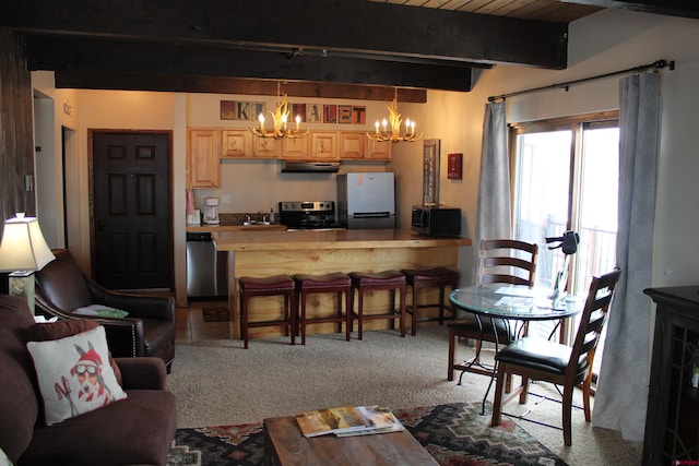 carpeted living room with beamed ceiling, sink, a chandelier, and wood ceiling