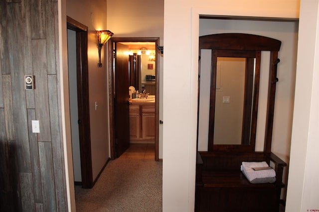 hallway with light colored carpet