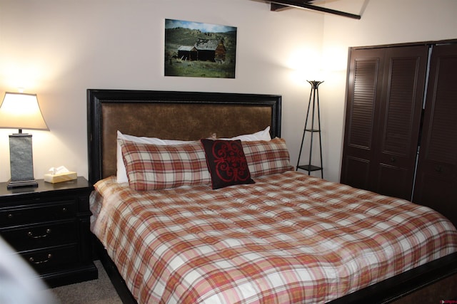 carpeted bedroom with a closet