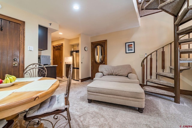 living room with light colored carpet