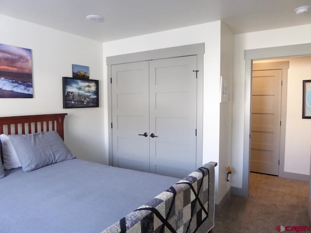 carpeted bedroom with a closet