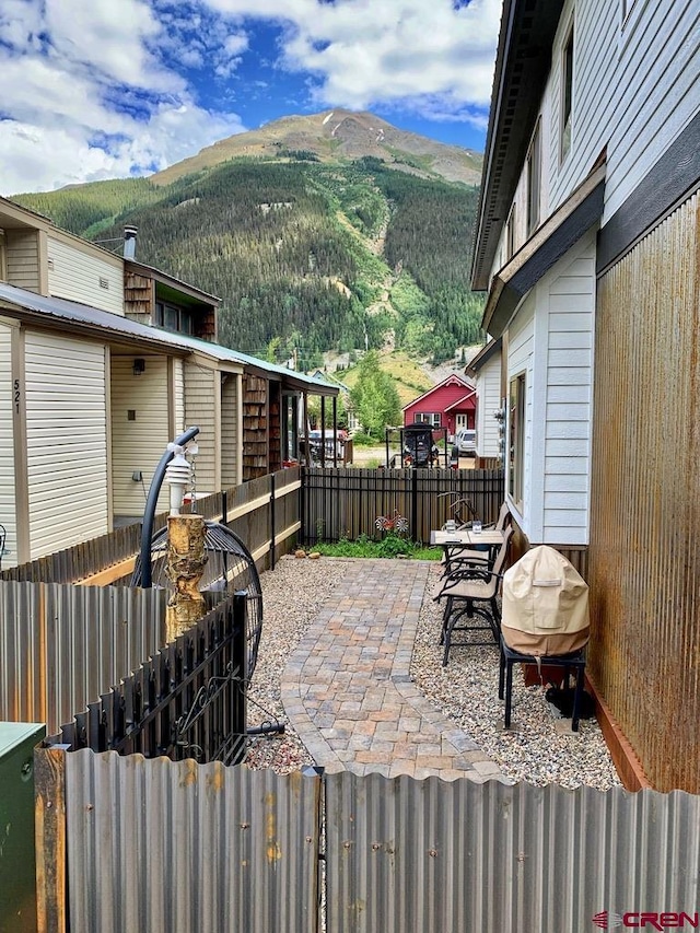 view of patio / terrace with a mountain view