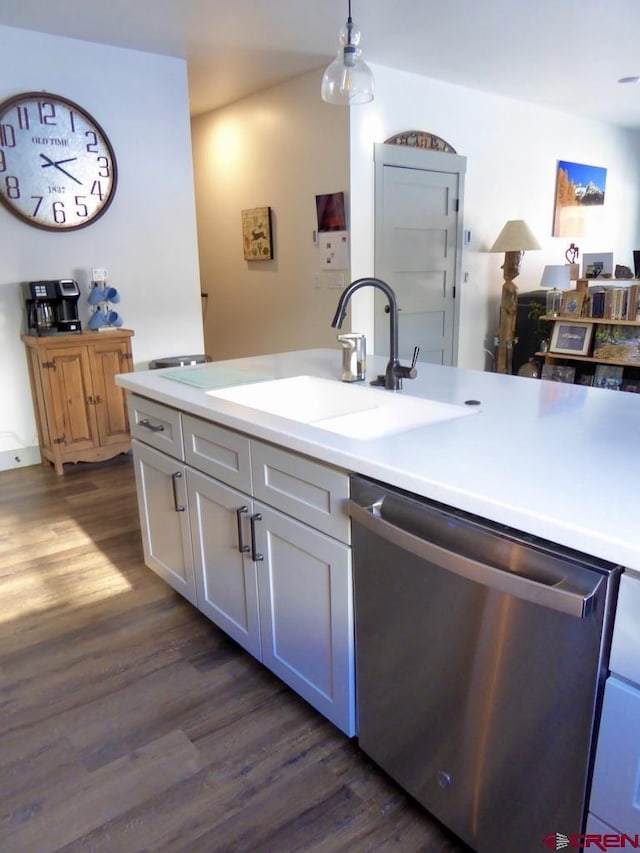 kitchen with pendant lighting, dishwasher, sink, dark hardwood / wood-style flooring, and white cabinetry