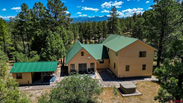 rear view of property featuring a patio