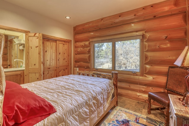 bedroom featuring log walls