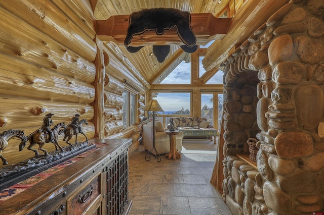 interior space with rustic walls and high vaulted ceiling