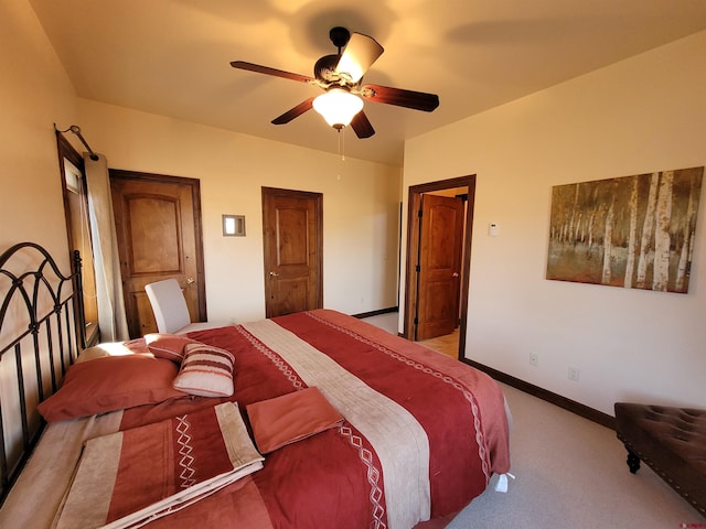 bedroom with ceiling fan and light colored carpet