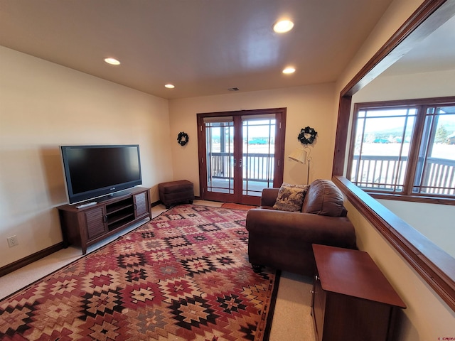 living room with light colored carpet and french doors