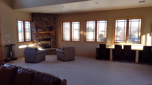 carpeted living room with a fireplace