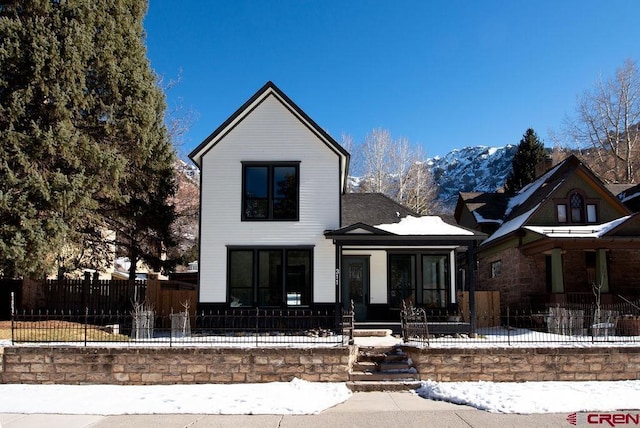 view of front of home with a mountain view