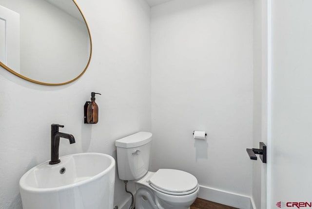 bathroom with toilet and sink