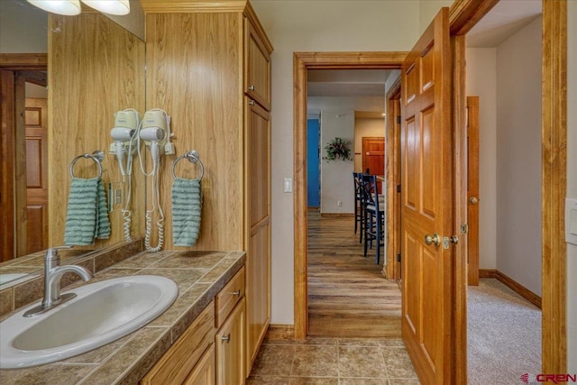 bathroom featuring wood-type flooring and vanity