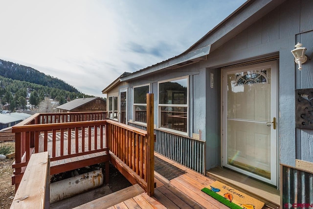 wooden deck featuring a mountain view