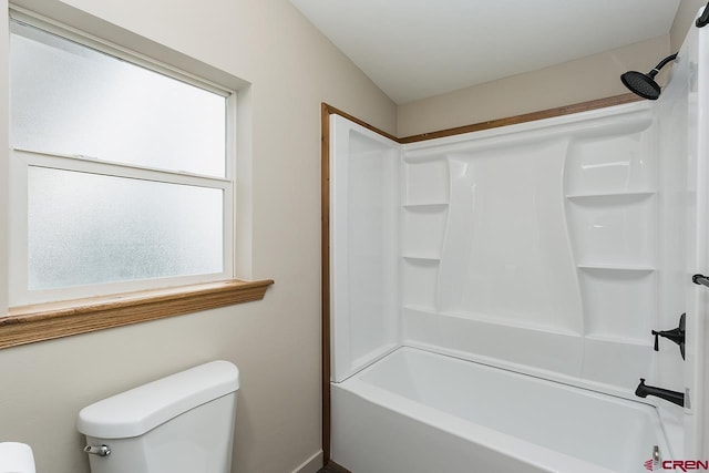 bathroom with a wealth of natural light, shower / bathing tub combination, and toilet