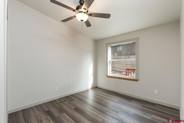 unfurnished room featuring dark hardwood / wood-style flooring and ceiling fan