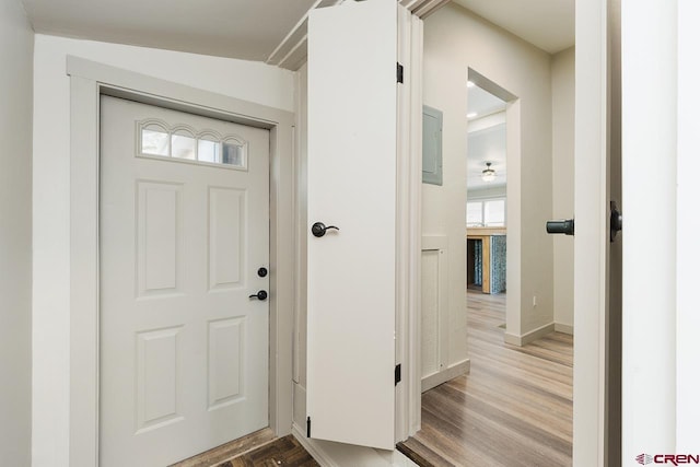 foyer entrance featuring light hardwood / wood-style flooring and lofted ceiling