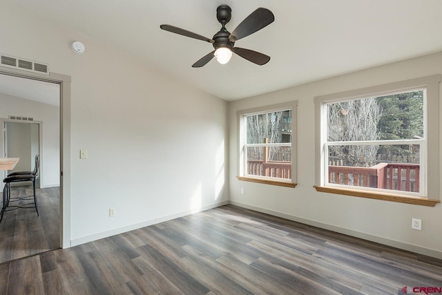 unfurnished room with hardwood / wood-style floors, vaulted ceiling, plenty of natural light, and ceiling fan