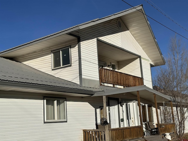 view of home's exterior with a balcony