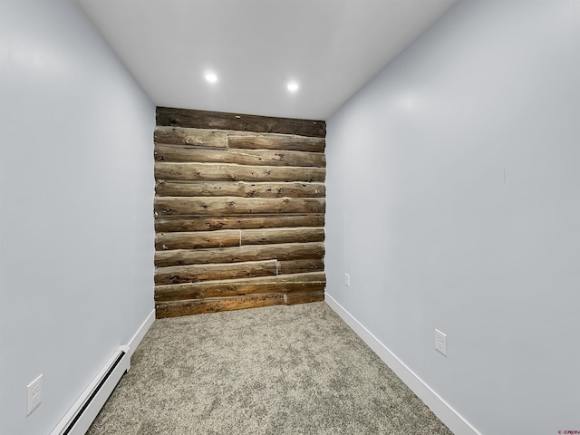 unfurnished room featuring a baseboard heating unit, carpet, baseboards, and recessed lighting