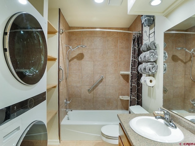 full bathroom featuring shower / tub combo, vanity, stacked washer and clothes dryer, tile patterned flooring, and toilet